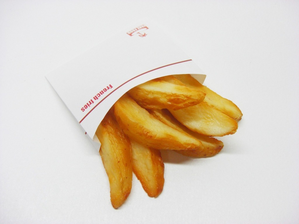 Paper bag containing French fries